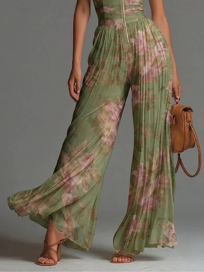 Charlotte™ | Flödande plisserad jumpsuit med gröna blommor